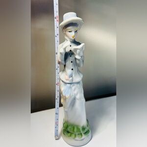 Porcelain figurine of a lady reading a book